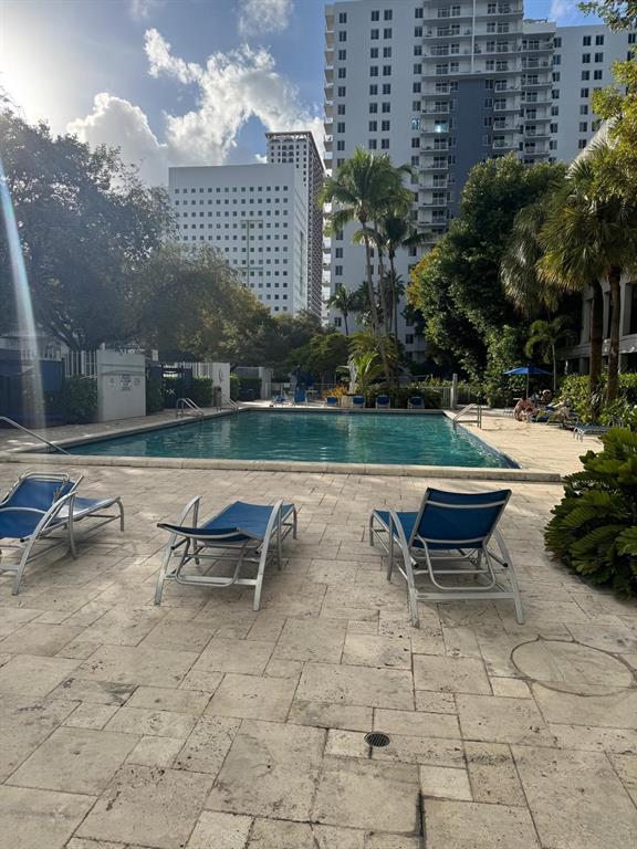 850 North Miami Avenue, Unit W703 Miami, FL 33136 - Photo 26 of 38 an outdoor sitting area with couch and outdoor seating