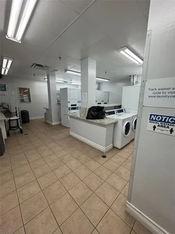 a kitchen with stainless steel appliances a stove a sink and a refrigerator