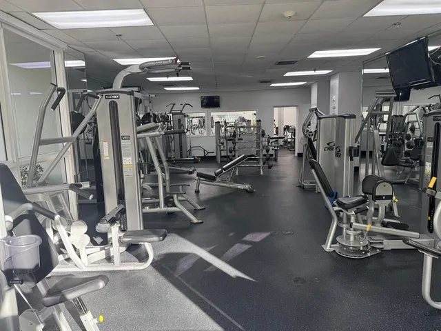 a gym room with gym equipment