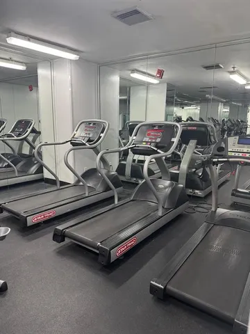 a view of building with yard and swimming pool