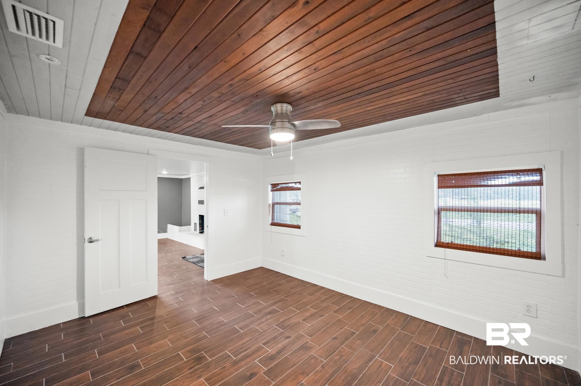 24663 Chestnut Street Elberta, AL 36530 - Photo 9 of 22 Recessed wood-panel ceiling with central ceiling fan and light fixture