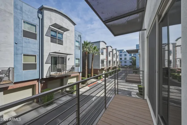a view of a balcony with chairs