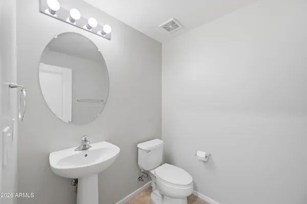 an empty room with a ceiling fan and window