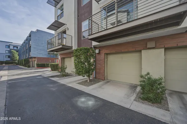 a view of a city with palm trees