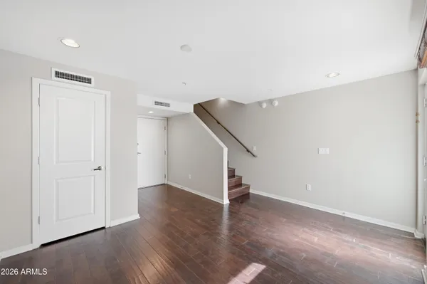 a open kitchen with stainless steel appliances granite countertop a stove top oven a sink and a refrigerator