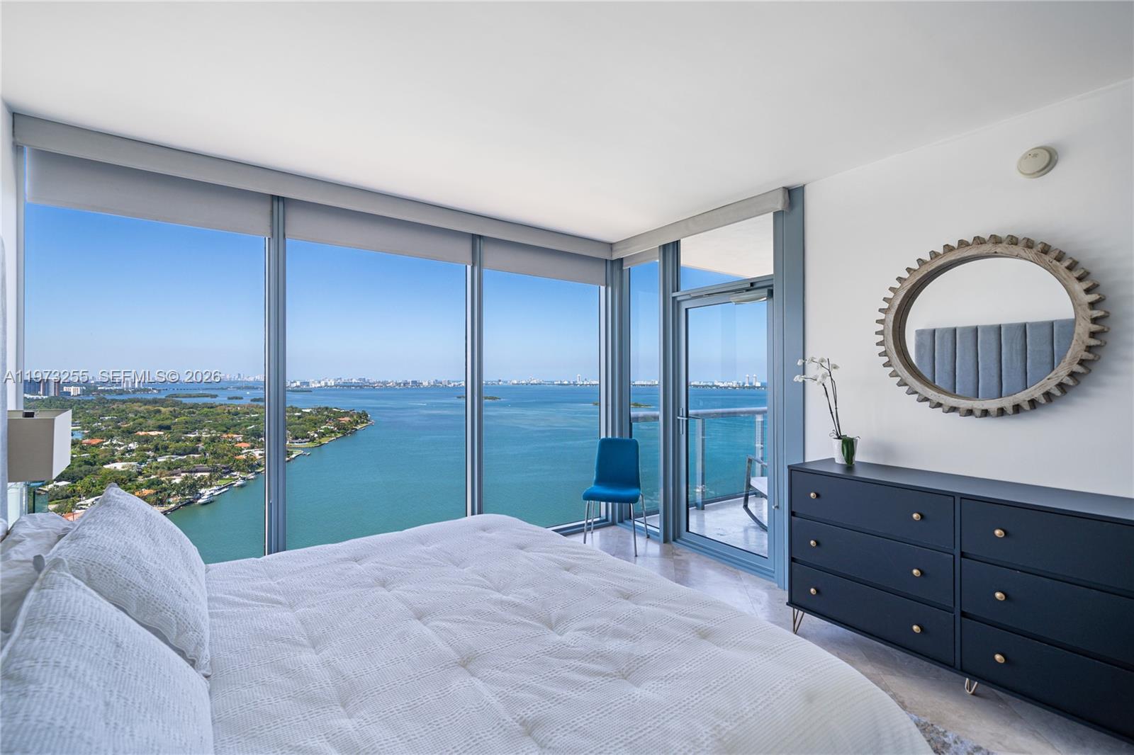 601 Northeast 36th Street, Unit 2908 Miami, FL 33137 - Photo 11 of 19 a bedroom with a large bed and a balcony view