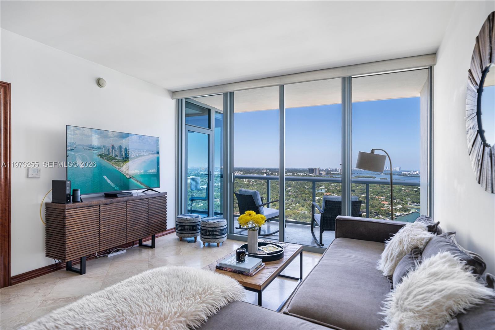 601 Northeast 36th Street, Unit 2908 Miami, FL 33137 - Photo 4 of 19 a living room with furniture and large window
