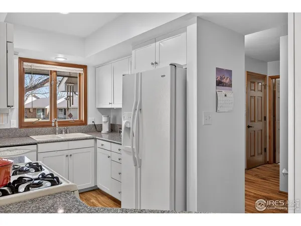 a kitchen with stainless steel appliances a sink and cabinets