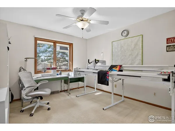 a work room with furniture and window
