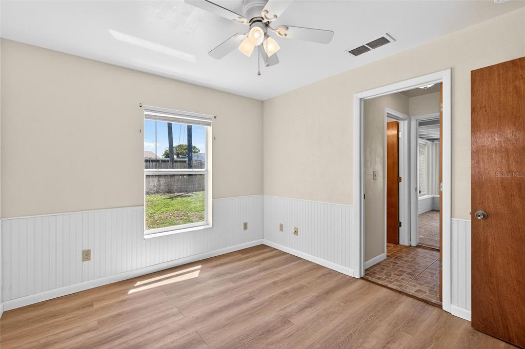 47 Carol Road Ormond Beach, FL 32176 - Photo 17 of 54 wooden floor in an empty room with a window