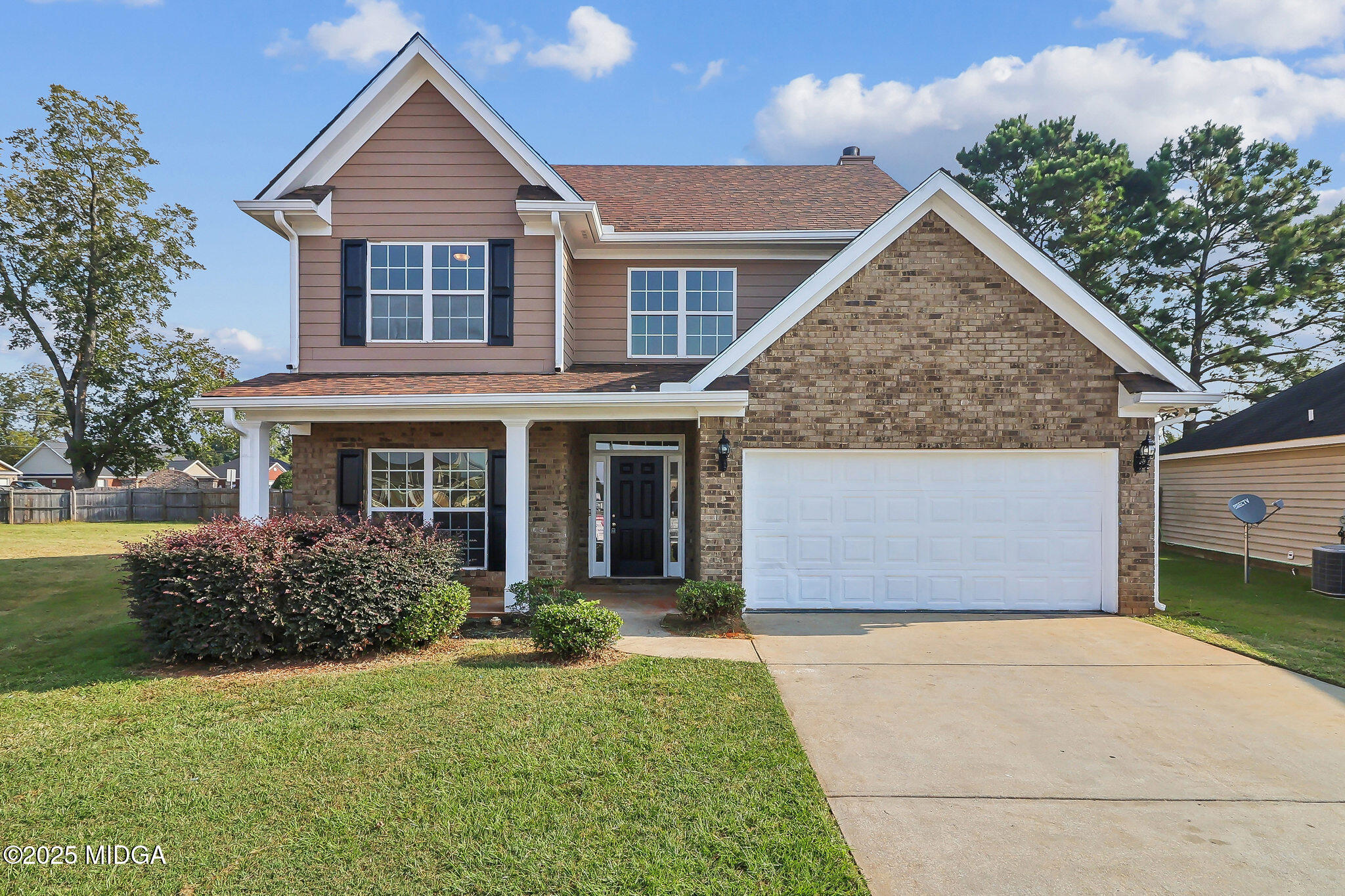 411 Bob White Road Macon, GA 31216 - Photo 1 of 1 a front view of a house with garden