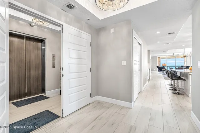 a kitchen with stainless steel appliances kitchen island granite countertop a refrigerator and microwave