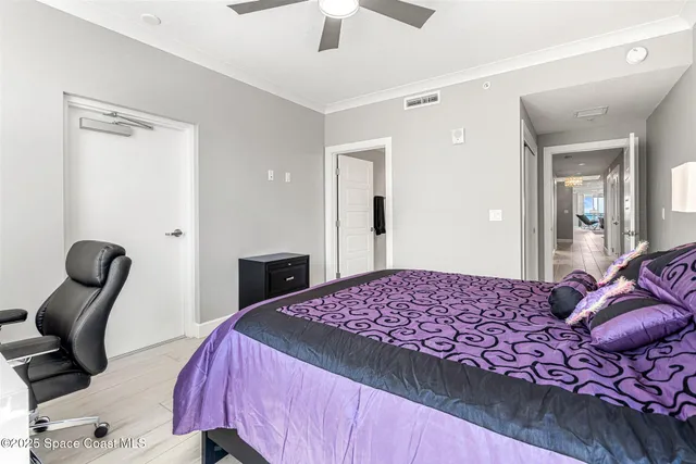 a bathroom with a granite countertop sink a toilet a mirror and bathtub