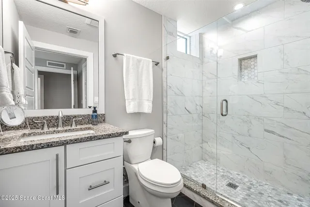 a utility room with sink dryer and washer