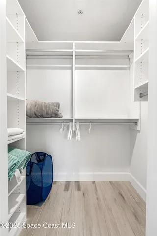 a view of a swimming pool with a lounge chair