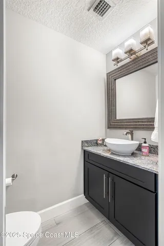 a swimming pool view with a outdoor seating space