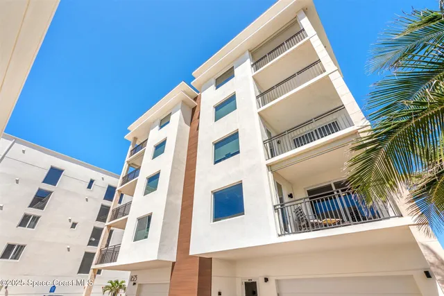 a kitchen with cabinets and chairs