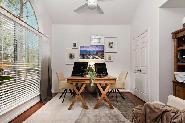 a work room with furniture and wooden floor