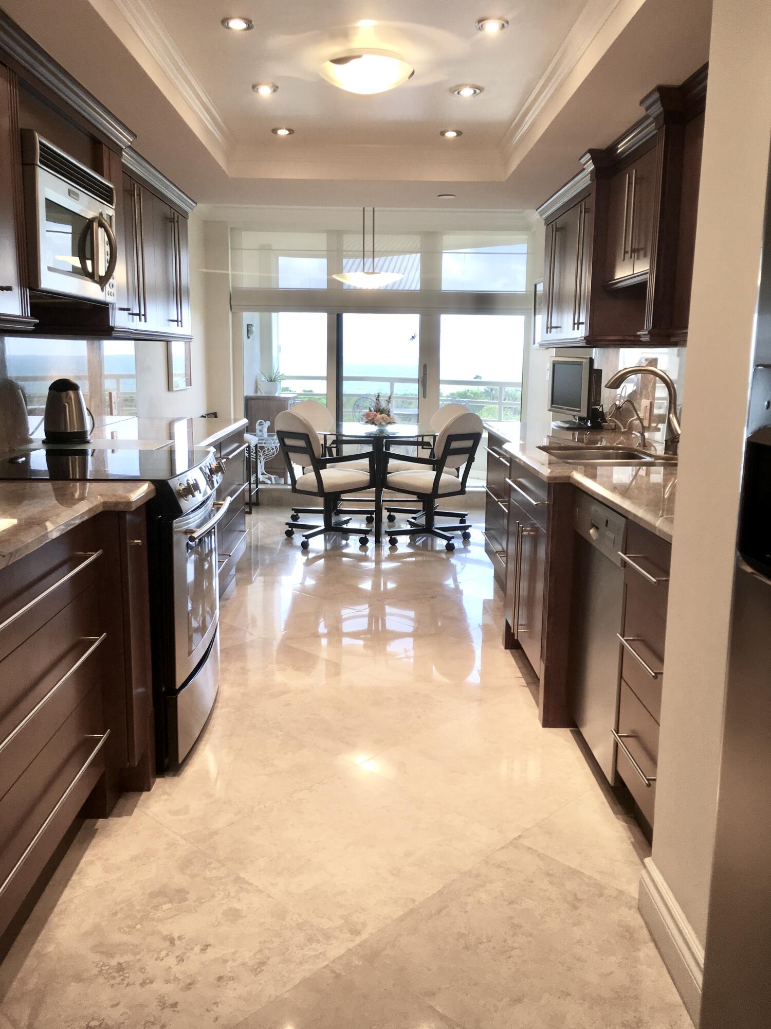 4101 North Ocean Boulevard, Unit 703 Boca Raton, FL 33431 - Photo 11 of 31 a kitchen with lots of counter top space