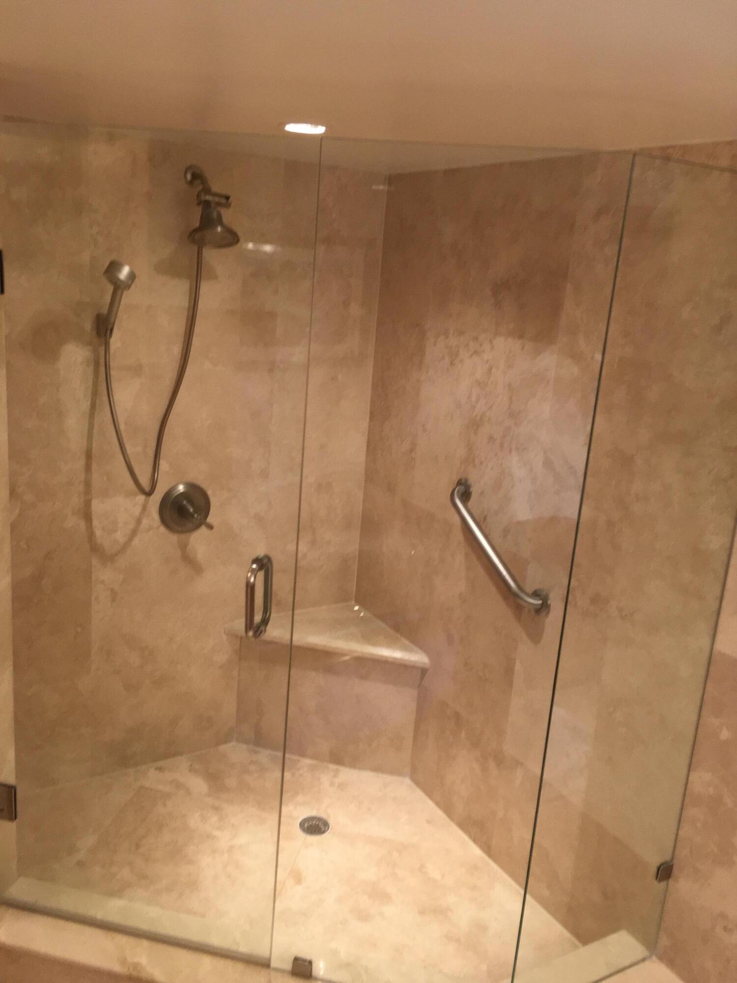 4101 North Ocean Boulevard, Unit 703 Boca Raton, FL 33431 - Photo 13 of 31 a bathroom with a shower