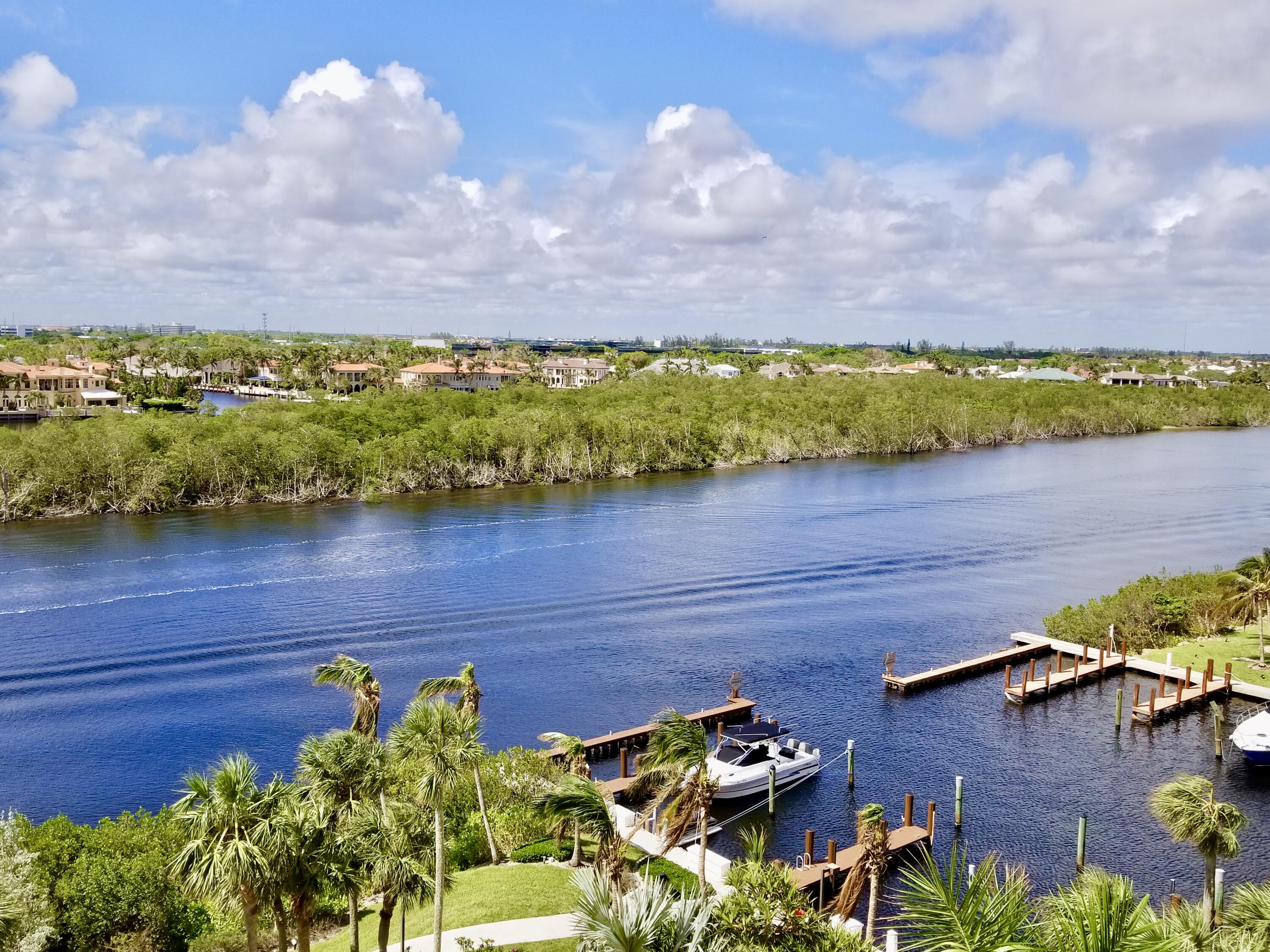 4101 North Ocean Boulevard, Unit 703 Boca Raton, FL 33431 - Photo 7 of 31 a view of a lake with a mountain in the background