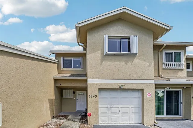 a front view of a house with a garage