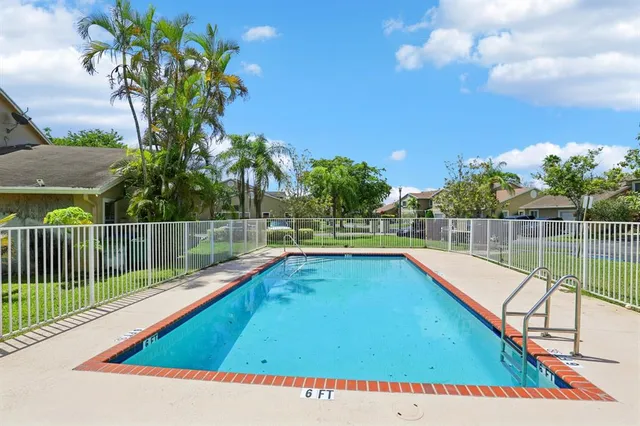 a view of a balcony with a swimming pool