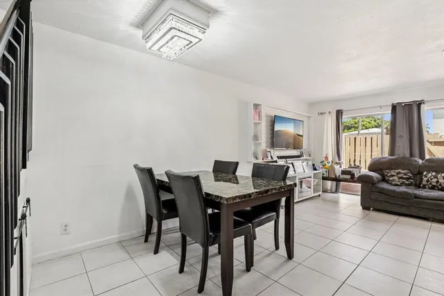 a view of a livingroom with furniture and a window