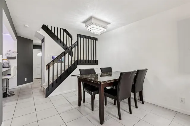 a view of a livingroom with furniture and entryway