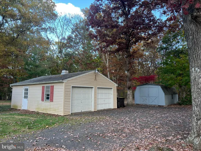 a front view of house with a yard and garage