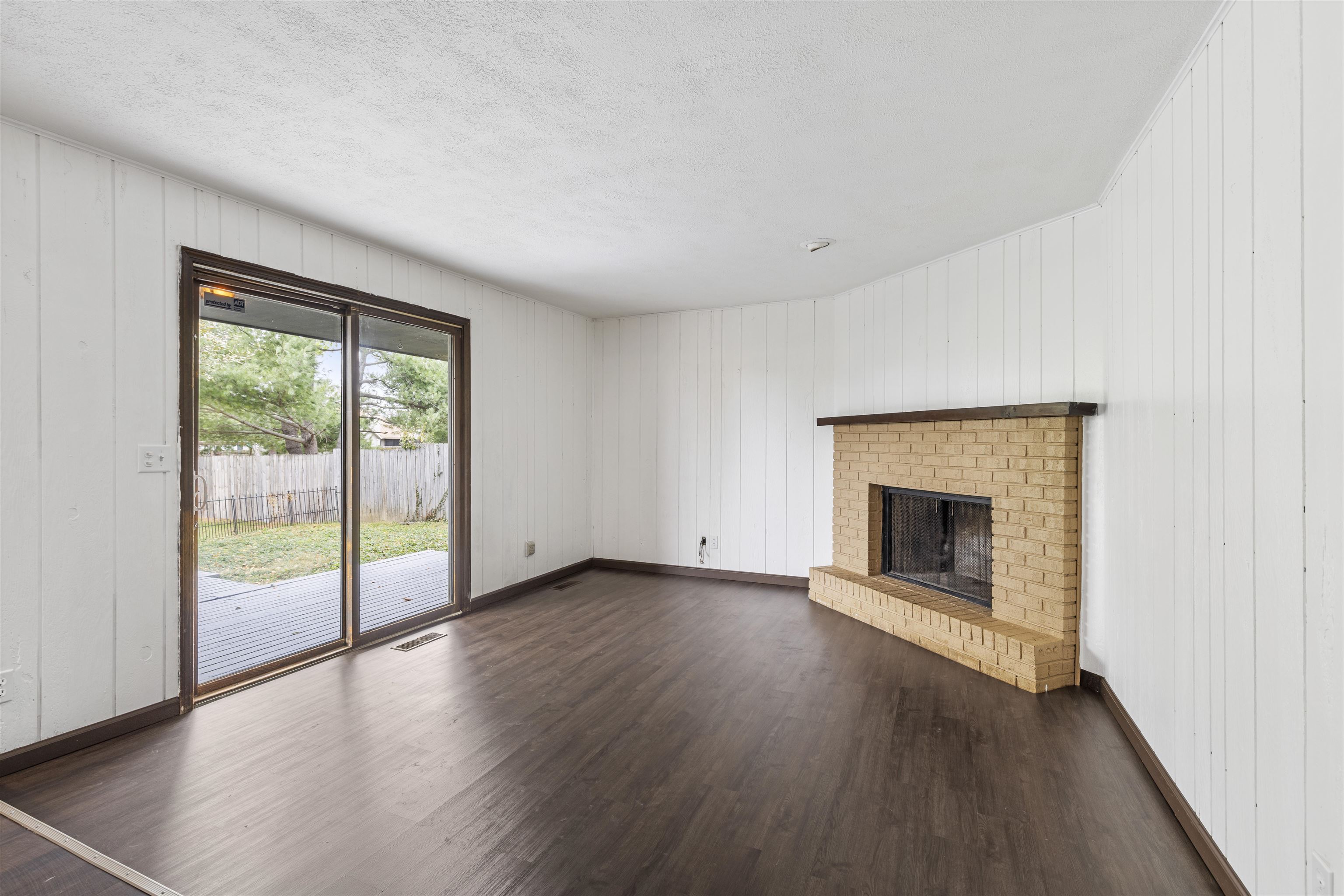 3428 Springwheat Street Rockford, IL 61114 - Photo 6 of 21 a view of an empty room with wooden floor and a window