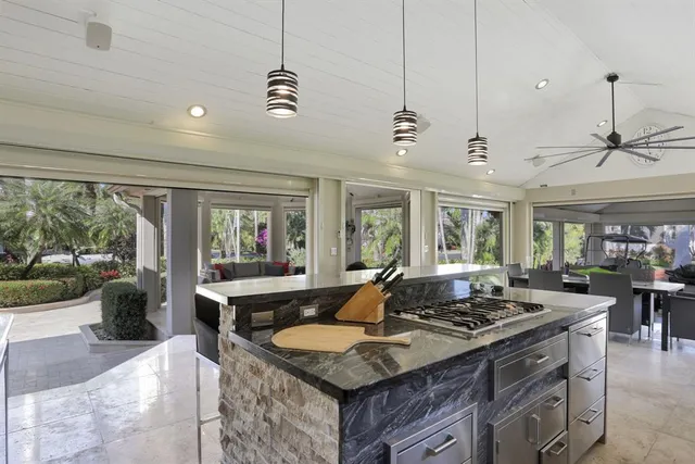 a kitchen with stainless steel appliances granite countertop a sink and cabinets