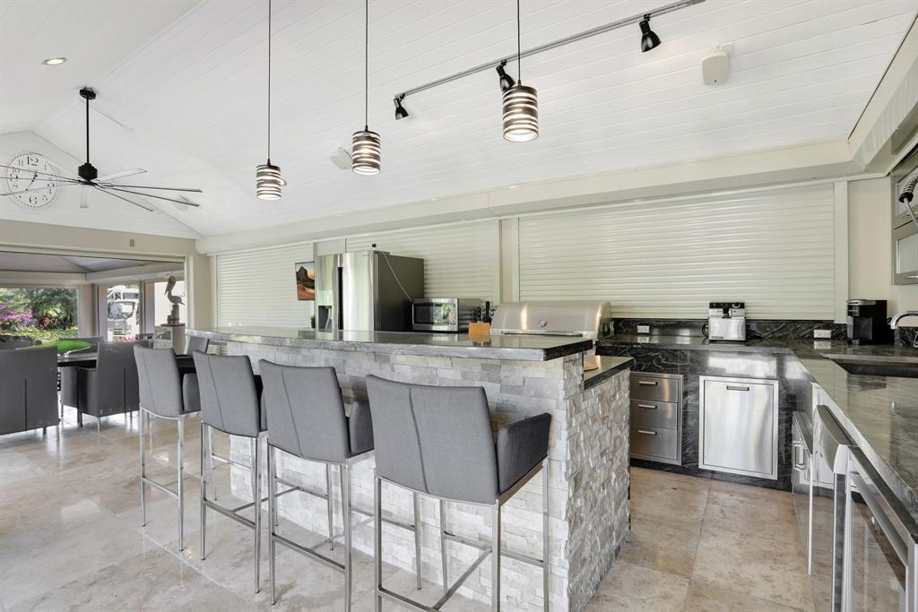 431 South Cortez Drive, Unit 431 Margate, FL 33068 - Photo 13 of 32 a kitchen with stainless steel appliances granite countertop a sink and cabinets