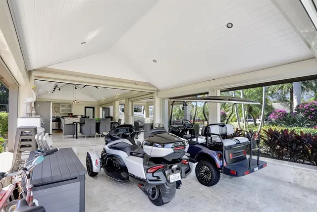 a front view of house with yard and trees around