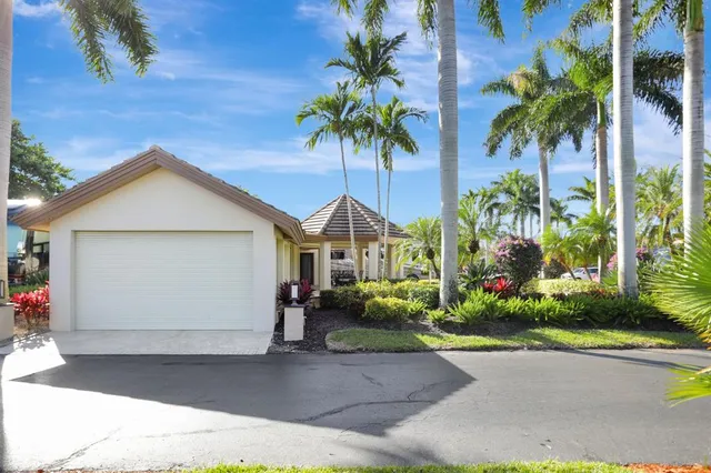 a front view of a house with a big yard