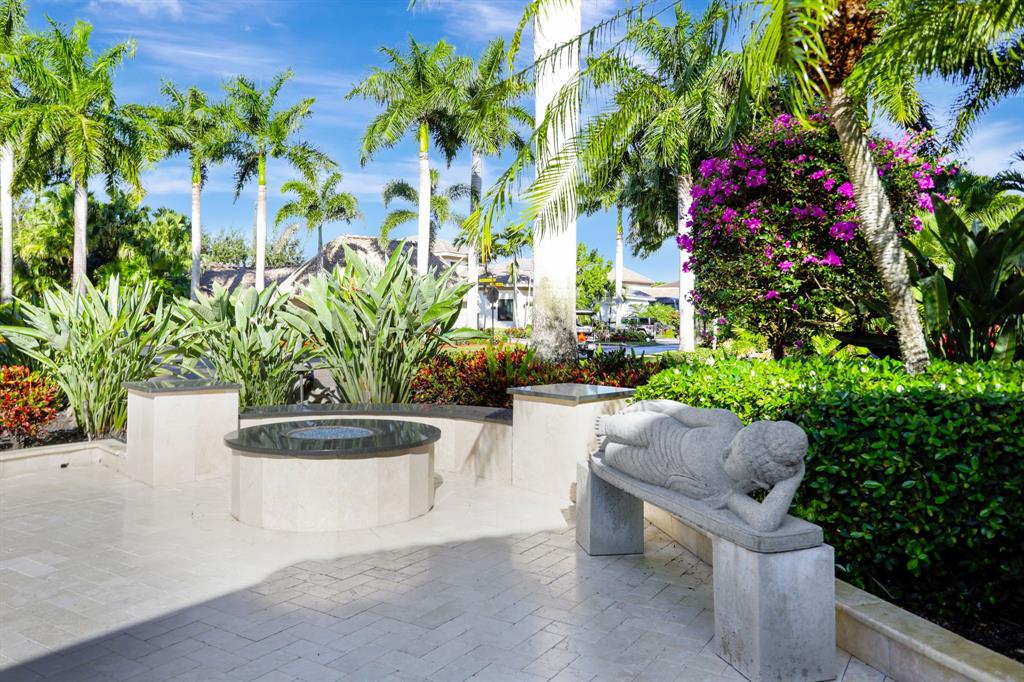 431 South Cortez Drive, Unit 431 Margate, FL 33068 - Photo 25 of 32 a view of a garden with plants and a bench