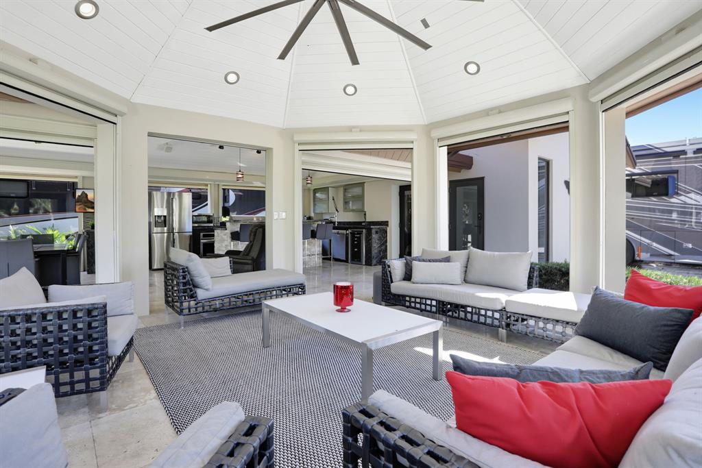431 South Cortez Drive, Unit 431 Margate, FL 33068 - Photo 5 of 32 a living room with furniture a rug and a chandelier
