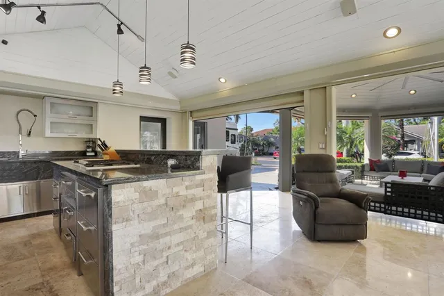 a kitchen with a stove a sink and a microwave