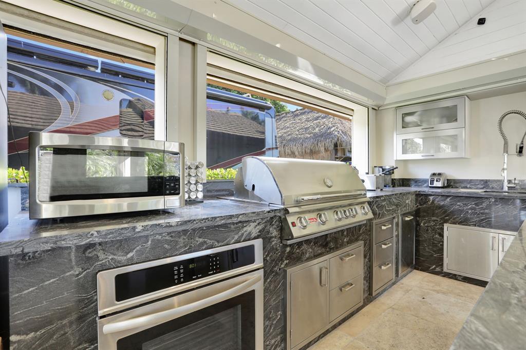 431 South Cortez Drive, Unit 431 Margate, FL 33068 - Photo 10 of 32 a kitchen with a stove a sink and a microwave
