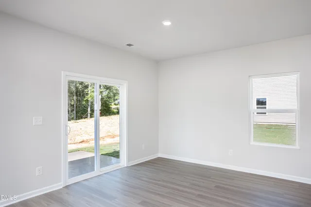 an empty room with windows