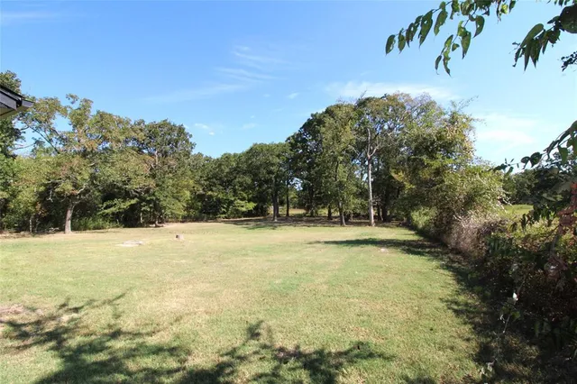 a view of a swimming pool with an outdoor space and seating area