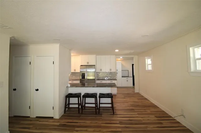 a view of a kitchen and dining room