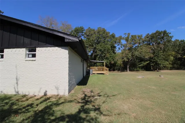 a backyard of a house with lots of green space