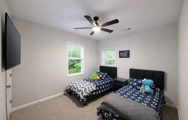 a bedroom with bed and a window