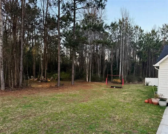 a view of a park with swings and a slide