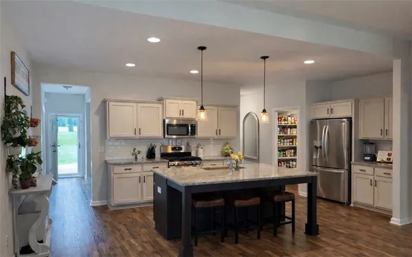 a kitchen with counter space cabinets and stainless steel appliances