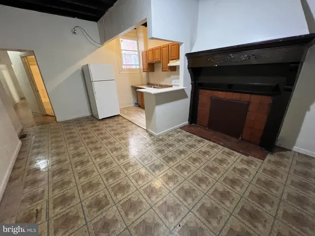 a kitchen with granite countertop a sink a stove a microwave and cabinets