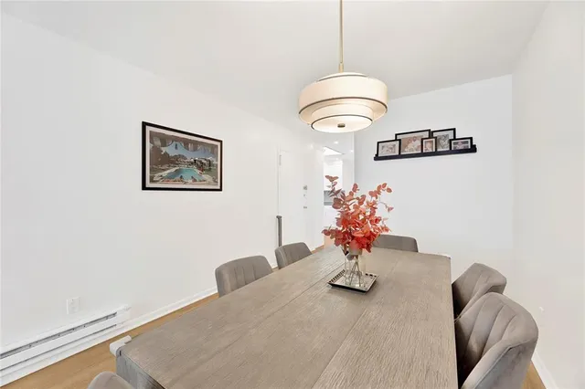 a glass vase with flowers on a table