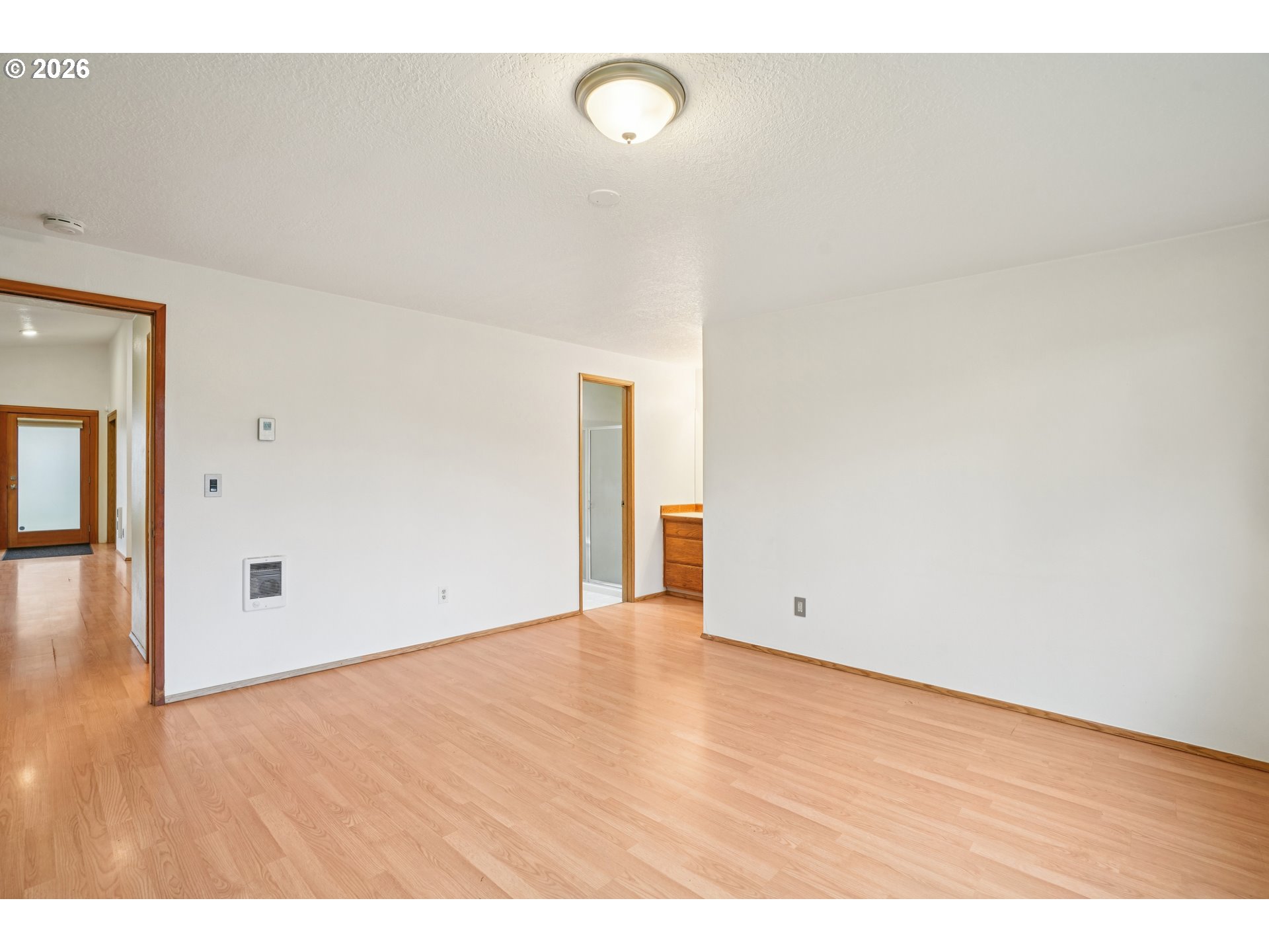 4133 Southeast Tibbetts Street Portland, OR 97202 - Photo 17 of 35 a view of an empty room with wooden floor and a window