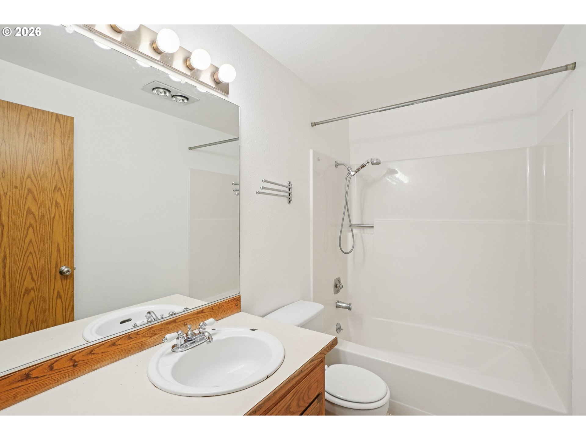 4133 Southeast Tibbetts Street Portland, OR 97202 - Photo 24 of 35 a bathroom with a sink a toilet a mirror and shower